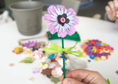 hand holding finished flower button