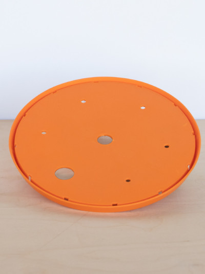 Soil saving insert. Circle disk fits inside a planter and reduces the amount of soil needed.